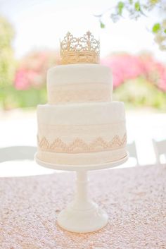 a wedding cake with a crown on top