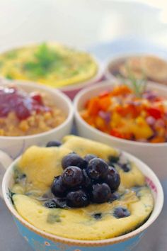 four bowls filled with different types of food