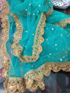 Turquoise green Indian dupatta for wedding function party wear. Size: Dupatta is 100 inches (2.5 meter) long and 40 inches (1 meter) wide. Length of this dupatta can be customized as per your requirement. Fabric and work: Sequnces embroidered net fabric with lace border. Delivery time: This dupatta will take 3-4 days to produce after we have received your order. While ordered with standard shipping it takes around 2-3 weeks in transit after we dispatch it. You can order with a shipping upgrade, Dupatta For Lehenga, Sequence Fabric, Designer Dupatta, Bridal Dupatta, Lehenga Suit, Golden Lace, Punjabi Outfits, Vert Turquoise, Kurti Designs Party Wear