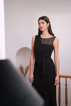 The Joanna Dress is made from scuba crepe and has a unique design with an asymmetric overlay bodice and a sheer yoke. The skirt features a flounce on the hem and a decorative bow waistband detail, while the pleats add a feminine touch.

# mother of groom dresses, special occasion dresses, little black dress, lbd, vestidos para eventos elegantes, vestidos largos de dia, vestidos elegantes para señoras, gala dresses, formal wedding guest dress, belos vestidos, fall wedding guest dress september Wedding Guest Dress September, Fall Wedding Guest Dress September, Mother Of Groom, Formal Wedding Guest Dress, Formal Wedding Guests, Tea Length Dress, Fall Wedding Guest, Fall Wedding Guest Dress, Mother Of Groom Dresses