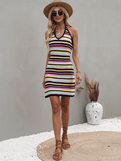 Our Shiela Knit Dress comes in playful colours of black, pink and yellow. Echoes of stripe patterns traveling down this knit textile that features a v neck, dress it up with our latest strappy sandal collection as a stylish summer look. Size Guide: Susan is 5’6” tall, and has a 33.5” bust, 24.8”waist, & 37.4” hips. She is wearing a S / US 4 / AU 8. This knit dress is true to size. Material: 100% Acrylic. Key Features: Mini length. V neckline. Relaxed fit. Sleeveless. Care Instructions: Machine w Knit V-neck Mini Dress For Day Out, Striped Mini Dress For Vacation, Trendy Striped Mini Dress For Day Out, Casual Striped Ribbed Mini Dress, Trendy Striped Dresses For The Beach, Casual Striped Mini Dress For Spring, Trendy Striped Mini Dress For Beach, Trendy Striped Mini Dress For Summer, Spring Striped Ribbed Dresses