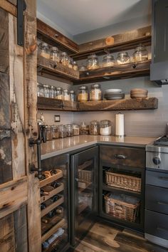 a kitchen filled with lots of wooden shelves