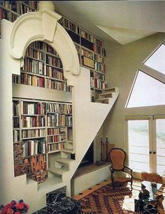 the stairs are made out of bookshelves and there is also a book case