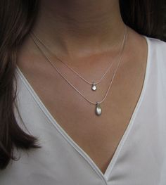 "This hand made teardrop pendant necklace has an effortless, earthy allure. The matte sterling silver pendant hangs at the base of a delicate sterling silver chain. This is the perfect necklace to pair with any casual outfit adding a bohemian vibe. Wear this alone, or layer it with your other favorites for a personalized eclectic look. ❉ F A C T S total length : 16\"/ 42 cm teardrop length: 1\"/ 2.54 cm teardrop width: 0.45\"/ 1.1 cm You will receive the necklace in a gift box ready to be given Delicate Teardrop Sterling Silver Charm Necklace, Everyday Teardrop Sterling Silver Charm Necklaces, Everyday Sterling Silver Teardrop Charm Necklaces, Everyday Sterling Silver Teardrop Charm Necklace, Silver Teardrop Drop Necklace With Pearl Pendant, Delicate Sterling Silver Teardrop Pendant Charm Necklace, Minimalist Pearl Drop Teardrop Necklace, Delicate Silver Teardrop Pendant Charm Necklace, Delicate Silver Teardrop Pendant Necklace