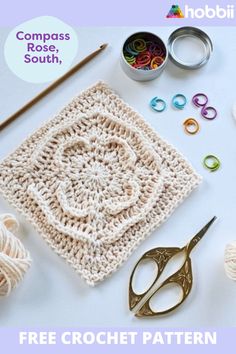 the crochet pattern is on display with scissors, yarn and other crafting supplies