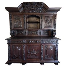 an old wooden cabinet with carvings on it