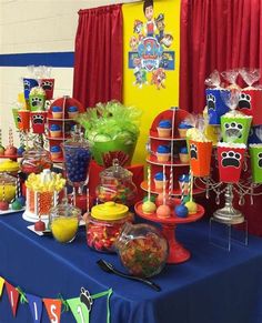 the table is covered with candy and candies