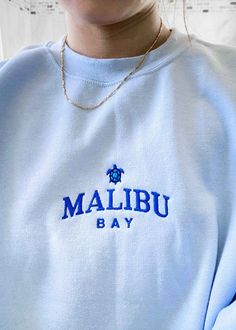 "Malibu Bay" and a cute turtle design embroidered in navy on a comfy crewneck. This cute crewneck is inspired by brandy melville and vintage nike sweatshirts. Casual Crew Neck Sweater With Embroidered Logo, Trendy Hoodie With Letter Embroidery And Crew Neck, Trendy Crew Neck Hoodie With Letter Embroidery, Casual Crew Neck Hoodie With Letter Embroidery, Crew Neck Sweater With Letter Embroidery For Streetwear, Trendy Crew Neck Hoodie With Embroidered Logo, Hoodie With Embroidered Logo For Loungewear, Loungewear Hoodie With Embroidered Logo, Casual Crew Neck Sweater With Embroidered Text