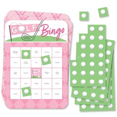 a pink and green golf game with white dots on the side, next to it's board