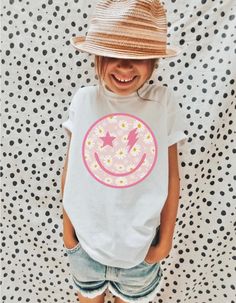 Thank you for visiting my shop! Please feel free to reach to me with anything you need! Best, Aly :) Distressed smile face toddler tee. Toddler Girl Clothes, Toddler Boy Clothes, Kids Shirts, Toddler Clothing, Toddler Shirts, Toddler Tshirts, Trendy Toddler Super comfy short-sleeve jersey t-shirt from 100% cotton. The tee is soft, durable, and bound to become the staple of your toddler's wardrobe. * 100% combed and ring-spun cotton * Fabric weight: 4.2 oz/yd² (142 g/m²) * Relaxed fit for extra c Cute Printed White Shirt, Fun White Printed Tops, White Top With Funny Print For Spring, Toddler Girl Tees, Toddler Graphic Tee, Toddler Boy Clothes, Toddler Girl Clothes, Kids Tees, Kids Tshirt