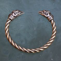 Please note that we only ship via FedEx (outside of the EU) and DPD (within the EU). The price is dependent on those carrier services' price lists. GRIFFIN, brass bracelet of our own design. It can be adjusted by bending. Griffin (also griffon or gryphon) is a legendary creature. It has a lion body, tail and back legs, while the wings and head belong to an eagle. Product of Wulflund, copyright. -   Material: brass Please note that FedEx does NOT deliver to PO boxes! Viking Style Bangle Bracelets, Medieval Style Bangle Jewelry Gift, Adjustable Medieval Style Bangle Jewelry, Medieval Bronze Jewelry For Larp, Medieval Style Bangle Bracelet As Gift, Medieval Bangle Bracelets For Gifts, Medieval Bangle Bracelets Gift, Viking Style Bracelet Jewelry Gift, Viking Style Metal Bracelet For Gift