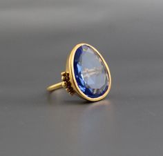 ♦♦ Beautiful handcrafted ring  ◘Stone Information:      Tanzanite Color Quartz     Color: Blue     Cut: Polki ◘ Metal: 925 Sterling Silver ◘ Band: 1.5 mm  ◘ Setting: Open back bezel setting ◘ Finish: High polish (shiny) ◘ Nickel free  ◘ Handmade band: 14 gauge solid sterling wire    This ring is adorably rustic, easy to wear, & stackable! ◘Please Note - The Ring in the Picture can be available or  Sold out. Every  Ring is Made of a     Unique Gemstone. Therefore, Colors and Inclusions of the Sto Quartz Color, Color Quartz, Quartz Colors, Tanzanite Gemstone, Ring Stone, Handcrafted Rings, Boho Ring, Unique Gemstones, December Birthstone