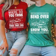 Get into the holiday spirit with our hilarious 'Bend Over and I'll Show You' Christmas couple matching shirts. Perfect for spreading festive cheer, these funny Christmas couple shirts are a fun and unique way to celebrate the season together!    Tired of the same old holiday ho-hum? Unwrap a little laughter with our Christmas Couple Matching Shirts!  Imagine strolling through a winter wonderland, radiating festive cheer and cheeky humor. Our shirts, emblazoned with the playful quip "Bend Over and I'll Show You," promise to turn heads and spark giggles at every holiday gathering.  This season, don’t just blend into the background—stand out with style and wit! These matching shirts are the perfect way to share a laugh and showcase your unique holiday spirit together.  Ready to spread some Ch Christmas Couple Shirts, Couples Christmas Shirts, Background Stand, Family Shirts Matching, Matching Couple Shirts, Christmas Couple, Couple Matching, Comfort Colors Tee, Holiday Gathering