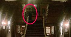 an image of a person walking down the stairs in a building with a red circle on it