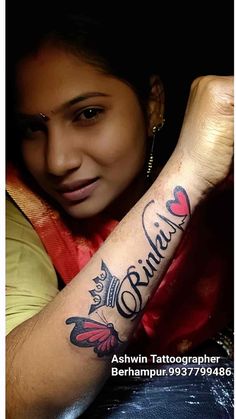 a woman with a tattoo on her arm