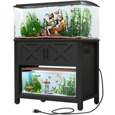 an aquarium with fish and plants in it on top of a stand that is connected to a power cord