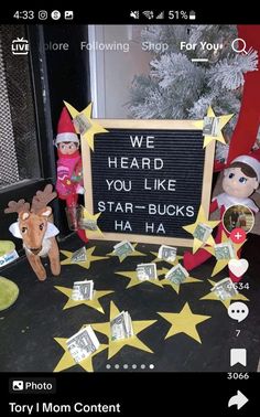 two elfs are standing in front of a sign that says we heard you like star - bucks ha ha