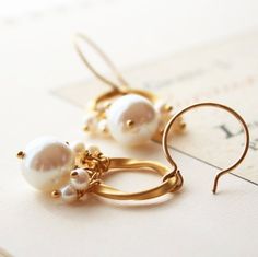 Pearl Earrings, Bridal Earrings, Wedding Jewelry, Bridesmaid EarringsTordu in French means twisted metal.  This piece of gold plated twisted metal is what is so beautiful about this earring.  A vintage glass pearl coupled with smaller freshwater pearls make a lovely classic earring for the bride.+ Vintage Glass Pearl. Freshwater Pearls. 14K Gold Fill Ear Wire.+ Earrings measure 1.75 inches (4.44 cm) in length.+ Earrings are ready to ship.+ Your jewelry will come in a jewelry box, tied with a rib Bride Vintage, Wedding Bridesmaid Jewelry, Twisted Metal, Bridal Earrings Pearl, Earring Ideas, Jewelry Bridesmaid, Classic Earrings, Wedding Bridal Jewellery, Garnet Earrings