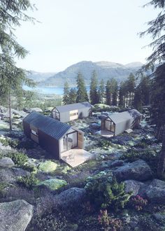 two small cabins in the middle of a rocky area with trees and bushes around them