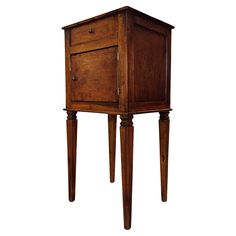 an old wooden cabinet with two legs and a drawer on one side, isolated against a white background