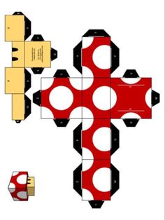 an origami paper cross with polka dots on the top and bottom, cut out into