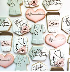 decorated cookies are arranged in the shape of doctors and nurse's coats with flowers on them