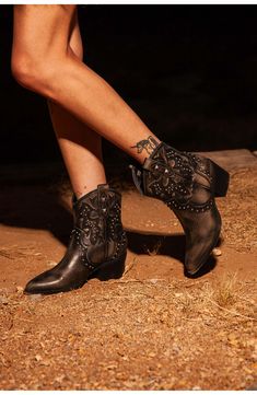 Polished studs and decorative stitching embolden a Western-inspired boot balanced by a pointy toe and stacked block heel. 2 1/4" heel Pull-on style Synthetic upper, lining and sole Imported Spring Pointed Toe Studded Boots, Studded Ankle-high Boots For Fall, Spiked Ankle Boots For Fall, Studded Ankle-high Heeled Boots For Fall, Ankle-high Studded Heeled Boots For Fall, Pointed Toe Boots For Festival, Fall Moto Boots With Rivets And Pointed Toe, Western Boots With Silver Studs And Round Toe, Fall Heeled Boots With Rivets And Pointed Toe