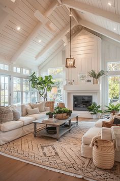 a living room filled with furniture and a fire place in the middle of an open floor plan