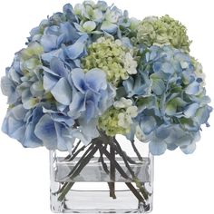 a clear vase filled with blue and green flowers