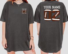 a women's football jersey with the number 22 on it and an image of a football