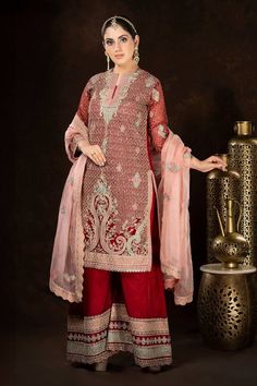 Red full sleeves A-line kurta with all over persian jaal embroidery using dori, thread and sequin highlights. Paired with a matching fleur embroidered palazzo and a contrasting baby pink scallop border fleur motif embroidered organza dupatta. - Aza Fashions Traditional Organza Wear With Dabka Details, Traditional Organza Wear With Dabka, Traditional Organza Wear With Dabka Embroidery, Traditional Red Chanderi Sharara, Traditional Shantoon Sharara With Drape, Red Chinon Salwar Kameez With Dupatta, Festive Nida Sharara With Straight Kurta, Red Embroidered Sets For Navratri, Traditional Red Sharara For Festive Occasions