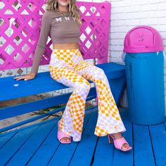 Make Waves In These Eye-Catching Stretchy Flare Pants. Made From A Comfortable Knit Fabric, These High-Waisted Pants Feature A Checkered Pattern Of Lilac And Orange For A Fun And Trendy Look. True To Size. 95% Polyester 5% Spandex Model Is 5'7 Wearing Size Small. Retro Purple Spring Bottoms, Trendy Non-stretch Purple Bottoms, Spring High Waist Purple Leggings, High Waist Purple Leggings For Spring, Retro Purple Cotton Bottoms, Trendy Fitted Purple Bottoms, Purple Trendy Leggings For Spring, Fitted Retro Purple Bottoms, Retro High Waist Purple Bottoms