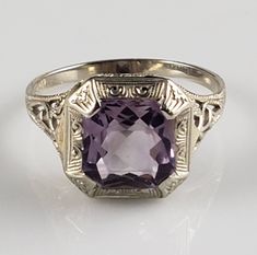 *Otsby Barton used the Maltese Cross Hallmark to denote the rare pieces he worked upon himself. This gorgeous ring is one of those remarkable & VERY rare pieces! It dates from around 1905-1912, just before Otsby perished aboard the Titanic on his last jewelry trip to Europe. He was accompanied by his daughter Helene, who survived to carry the company into the 20th century. Helene Otsby never married & mourned her father for the rest of her life. This ring is extremely rare & highly collectible! Trip To Europe, Amethyst Set, The Titanic, Gorgeous Ring, Maltese Cross, Amethyst Gem, Carved Shell, Purple Band, Filigree Ring