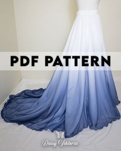 a white and blue dress on display with the text, free pattern for this gown