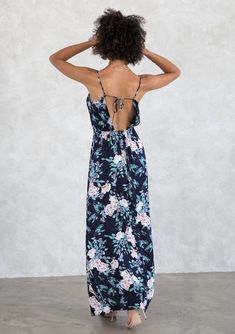 A minimalist maxi dress with luxurious, understated details. Our silky cowl neck maxi dress is designed in a show-stopping floral print. With a sexy side slit and a strappy tie back. A sophisticated silhouette for your next occasion, pair it with a strappy sandal or dress it down with boots and a leather jacket.  FINAL SALE Floral print Silky maxi dress Relaxed fit Sleeveless Maxi length Side slit Cowl neckline Open back with adjustable ties Half-elastic waist at the back  Special occasion Model is 5'8, wearing a size S.Style: I-72465W-ROM-BS Silky Maxi Dress, Cowl Neck Maxi Dress, Maxi Dress Navy, Holiday Ready, Cowl Neckline, Strappy Sandals, Cowl Neck, Open Back, Final Sale