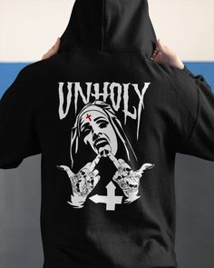 Unholy Nun Halloween Hoodie  Kv Shipping from the US. Easy 30 day return policy, 100% cotton, Double-needle neck, sleeves and hem; Roomy Unisex Fit. Hip Hop Halloween Hoodie Top, Punk Halloween Hoodie Sweatshirt, Halloween Hoodie For Streetwear, Halloween Hoodie With Crew Neck For Streetwear, Punk Halloween Hooded Top, Hip Hop Halloween Hoodie With Graphic Print, Punk Halloween Hoodie Top, Halloween Punk Hoodie Tops, Halloween Hip Hop Hoodie With Letter Print