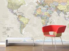 a chair sitting in front of a wall with a map on it