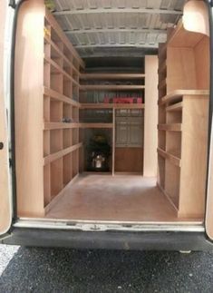 the inside of an empty storage truck with shelves