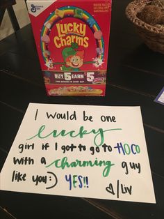 a handwritten note from lucky charms on a table next to a box of lucky charms