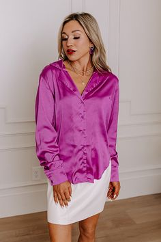 - You will love this luxe feeling pajama top! - A collared v-cut neckline - A button up front - Long sleeves with button closure cuffs - A relaxed silhouette that ends in a rounded hemline Button Closure Top For Pajama Party In Spring, Chic Purple Top With Button Cuffs, Chic Blouse For Loungewear, Chic Solid Blouse For Loungewear, Elegant Tops For Pajama Party In Spring, Chic Solid Color Blouse For Loungewear, Elegant Tops For Spring Pajama Party, Chic Purple Tops For Loungewear, Long Sleeve Blouse For Pajama Party