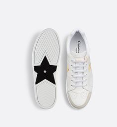 The Dior Star sneaker, a House essential, is distinguished by its timeless lines. Crafted in white calfskin, it is embellished with a tonal suede calfskin insert on the front. Gold-tone CD and Christian Dior Paris signatures adorn the style, while a gold-finish metal star enhances a lacing eyelet. Completed by a thin signature sole, the lightweight sneaker will give the finishing touch to any relaxed outfit, any time of year.. 36 Dior Gold, Christian Dior Paris, Dior Star, Dior Paris, Icon Shoes, Metal Star, Ballerina Pumps, Relaxed Outfit, Dior Book Tote