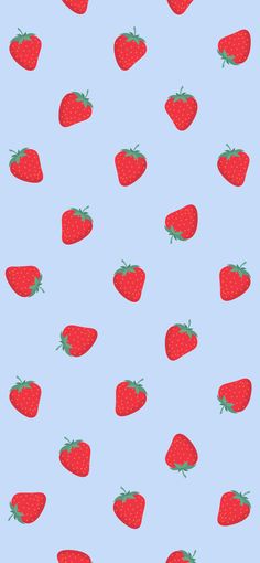 a blue background with red strawberries on it