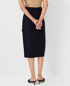 Elevate your wardrobe with the Ann Taylor Tie Waist Cargo Pencil Skirt, a blend of sophistication and practicality. This skirt is designed to cater to the modern woman's needs, featuring a sleek black color that pairs effortlessly with any top.

- **Size**: 14 (Regular)
- **Color**: Black
- **Material**: Shell: 67% Lyocell, 18% Linen, 15% Viscose; Lining: 100% Polyester
- **Gender**: Female
- **Length**: 28 inches long
- **Features**: Front flap cargo pockets, self-tie belt, belt loops, hidden b Chic Pencil Skirt With Pockets For Work, Fall Workwear Cargo Skirt With Belt Loops, Pencil Skirt With Side Pockets For Work, Relaxed Skirt With Tie Waist For Work, Spring Workwear Pencil Skirt With Pockets, Relaxed Tie Waist Skirt For Workwear, Utility Relaxed Skirt For Work, Black Cargo Skirt For Work, Fall Workwear Pencil Skirt With Pockets