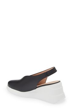 A deep V-cut silhouette defines the vamp of this almond-toe slingback set on a textured platform. 2 1/2" heel; 3/4" platform (Size 39) Leather upper and lining/synthetic sole Made in Spain Leather Platform Slingback Pumps With Pointed Toe, Formal Platform Slingback Wedge Sandals, Modern Black Slingback Wedge Sandals, Formal Slingback Platform Wedge Sandals, Evening Platform Slingback Sandals In Synthetic, Modern Platform Slingback Sandals For Formal Wear, Modern Platform Slingback Sandals For Formal Occasions, Modern Formal Platform Slingback Sandals, Formal Wedge Heel Slingback Pumps