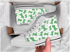 These cute green dinosaur shoes are sure to attrack some attention ! Our custom made shoes will make the best gift for any occasion! All of our sneakers are custom-made-to-order and handcrafted to the highest quality standards Check out more of our footwear here: https://www.etsy.com/shop/unicornshoesshop/ Product Name: Green Dinosaur Shoes | Dinosaur Sneakers | Cute Dinosaur Shoes, Custom High Tops Sneakers For Adults Women Men Girls & Boys Product Features; ▶ Full canvas double sided print Casual Lace-up Sneakers As Gift, Shoes High Tops, Dinosaur Shoes, Sneakers Cute, High Tops Sneakers, Style Converse, High Top Converse, Green Dinosaur, Custom Made Shoes