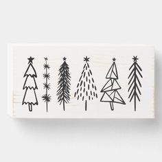 a rubber stamp with christmas trees on it