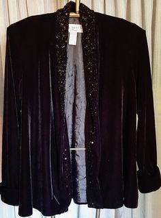 This is a very nice evening jacket.  The beaded lapel gives it a very dressy look.  It's nicely lined.  Armpit to armpit is 22 inches.  Sale is final Embellished Long Sleeve Outerwear For Night Out, Long Sleeve Sequined Blazer For Evening, Elegant Embellished Evening Blazer, Elegant Evening Embellished Blazer, Winter Embellished Long Sleeve Blazer, Elegant Embellished Fall Outerwear, Embellished Long Sleeve Party Outerwear, Formal Long Sleeve Sequin Blazer, Long Sleeve Sequin Blazer For Formal Occasions