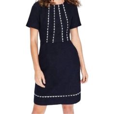 This Beautiful Navy Blue A-Line Dress By Boden Features Scalloped Trim And A Zip Closure. The Short-Sleeved Dress Has A Round Neckline And A Casual Sleeve Type, Making It Perfect For Any Occasion Whether It Be Travel, Party, Casual, Workwear Or Business. The Dress Is Made From Woven Cotton Material And Is Suitable To Wear In Summer, Fall, And Spring. Short Sleeve Lined Mini Dress For Work, Lined Short Sleeve Mini Dress For Work, Chic Navy Short Sleeve Dress, Navy Fitted A-line Midi Dress, Fitted Navy Mini Dress For Workwear, Navy Fitted Mini Dress For Work, Navy Short Sleeve Mini Dress For Work, Navy Fitted Knee-length Dress, Navy A-line Mini Dress For Spring