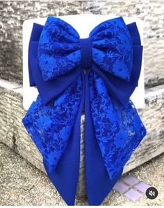 a blue bow tie on top of a white box