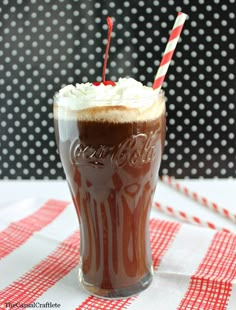 a chocolate milkshake with whipped cream and candy canes